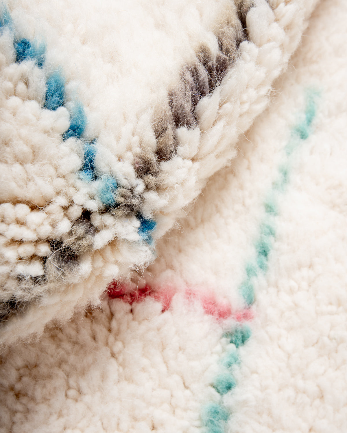 Modern, designer, handcrafted Berber rug from Morocco. Beniourain carpet with beautiful colours and patterns and fluffy wool texture.